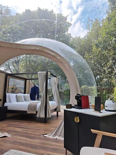 a bedroom with a bed under a tent at Cromore Retreat in Portstewart