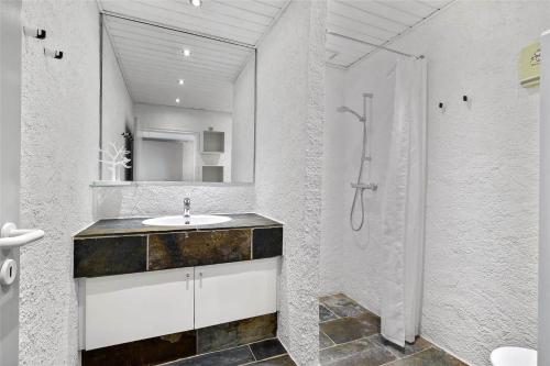 a bathroom with a sink and a shower at BL1540-Blokhus-Jens-Baerentsvej-14 in Blokhus