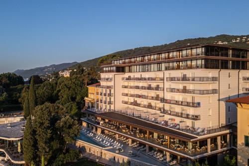 an aerial view of a hotel with a mountain in the background at Amadria Park Grand Hotel 4 Opatijska Cvijeta in Opatija