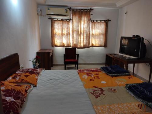 Katil atau katil-katil dalam bilik di Hotel Kismat Mahal