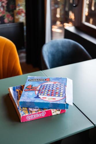 a stack of two boxes of crisps sitting on a table at Mamie Megève in Megève