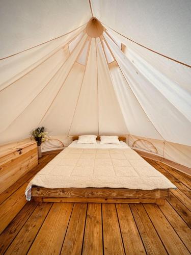 a bedroom with a bed in a tent at Jelena in Kutná Hora