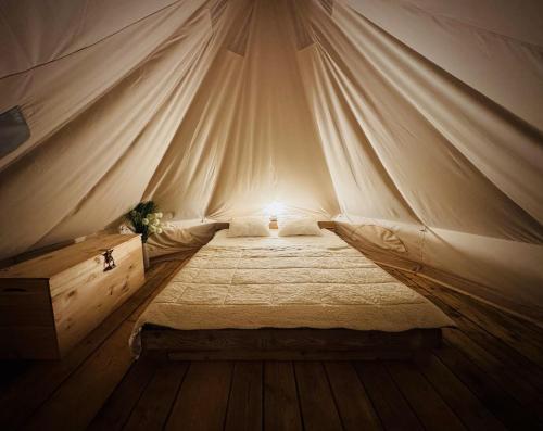 a bedroom with a bed in a tent at Jelena in Kutná Hora
