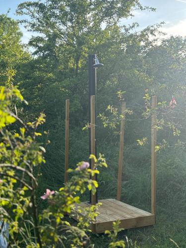 a wooden platform with a bird perched on top of it at Jelena in Kutná Hora