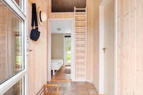 a tiny house with a ladder in the hallway at BL1399-Saltum-Laustvej-30 in Saltum