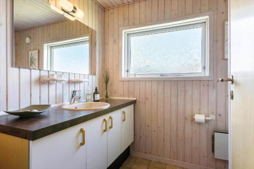 a bathroom with a sink and a mirror at BL1462-Saltum-Revlingevej-32 in Saltum