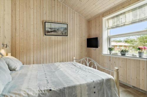 Ένα ή περισσότερα κρεβάτια σε δωμάτιο στο BL1220-Blokhus-Peter-Andersensvej-21