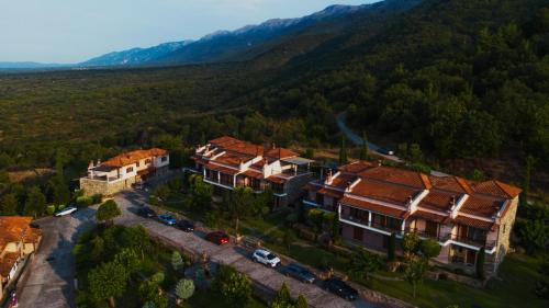 an aerial view of a large house in a mountain at Hotel Epavlis in Káto Poróïa