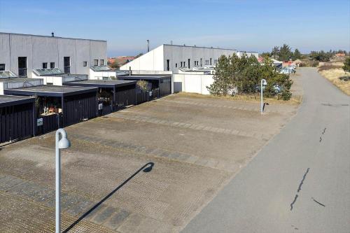 an empty parking lot next to a building at BL1538-Blokhus-Ferren-42 in Blokhus