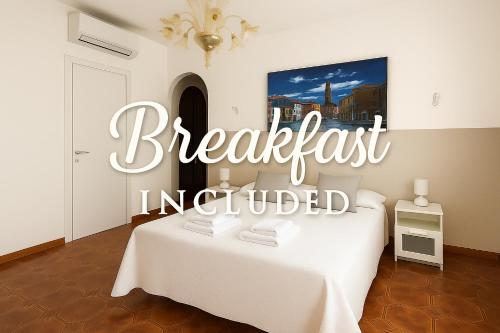 a sign that reads breakfast incorporated in a white room at B&B Airport Venice Diego in Tessera