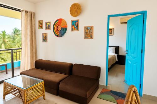a living room with a couch and a bed at 1 bhk Home Palolem Beach in Canacona