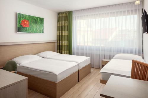 Postel nebo postele na pokoji v ubytování Hotel Ankora