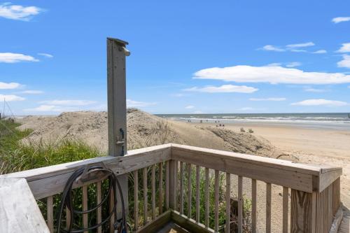 a view of the beach from the porch of a beach house at 2 Bedroom Oceanview Condo at Sea Cabin! Sleeps 5! in Myrtle Beach