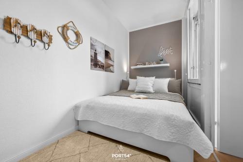 Postel nebo postele na pokoji v ubytování Ferienwohnung Küstenzauber 7603 Marina Wendtorf