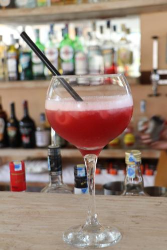a drink in a glass sitting on a table at Eleven Pearl Boutique Hotel & Spa in Diani Beach