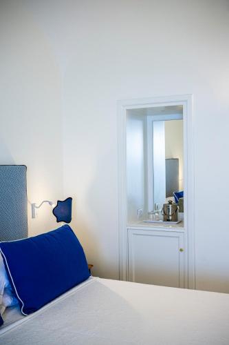 Una cama o camas en una habitación de Buca Di Bacco