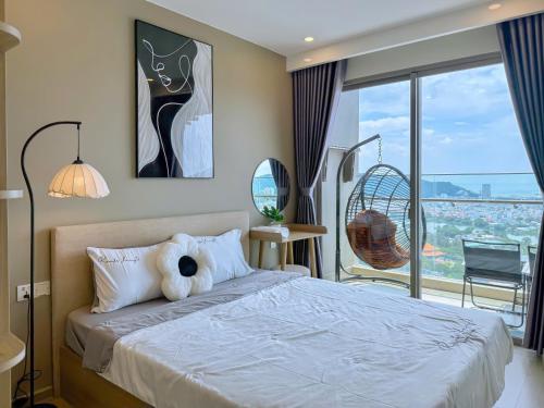 a bedroom with a bed with a teddy bear on it at Gạo's Homestay - The Song in Vung Tau
