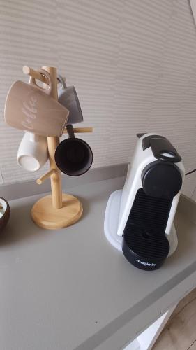 a kitchen counter with a toaster and a lamp on it at Camino in Vrouwenpolder