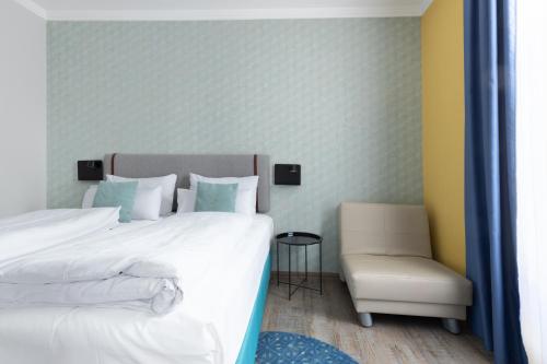 Cama o camas de una habitación en Garner Hotel Vienna by IHG