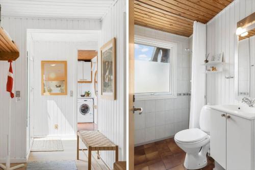 a bathroom with a toilet and a sink at BL1020-Pandrup-Hunetorp-Klitvej-257 in Pandrup