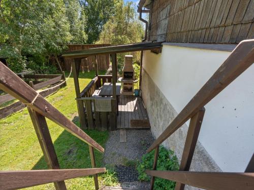 a stairway leading up to a building with a wooden railing at Holiday Home Lenora II by Interhome in Lenora
