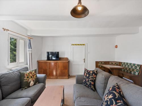 a living room with a couch and a table at Holiday Home Lenora II by Interhome in Lenora