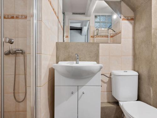 a bathroom with a sink and a toilet and a shower at Holiday Home Lenora II by Interhome in Lenora