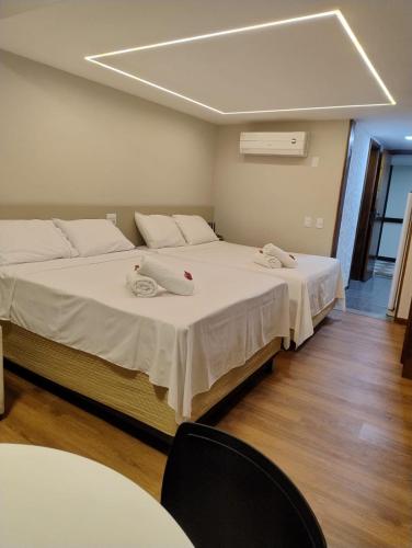 Ένα ή περισσότερα κρεβάτια σε δωμάτιο στο Flat Encanto Baiano