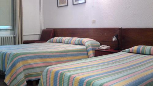 Cama o camas de una habitación en Hotel Peralba