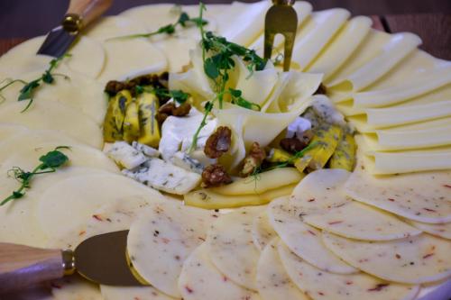 a plate of food with bananas and nuts on it at Hotel Świt in Kraków