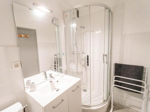 a white bathroom with a shower and a sink at Studio 2 pers. Sud avec balcon à Valloire - FR-1-263-53 in Valloire