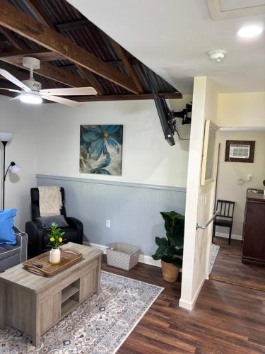 a living room with a couch and a coffee table at Harmons Landing in Hawthorne