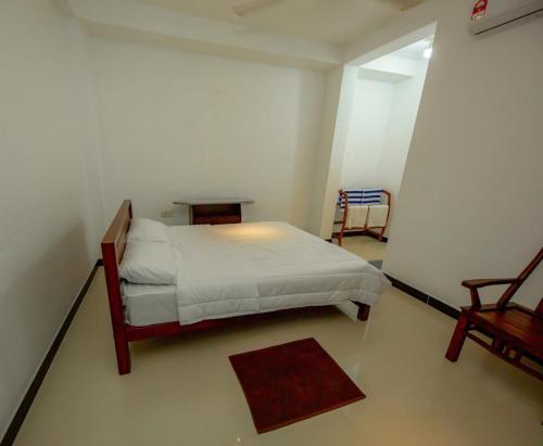 Postel nebo postele na pokoji v ubytování Ceylon Heart Beach Villa