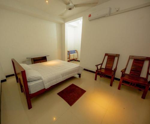 Postel nebo postele na pokoji v ubytování Ceylon Heart Beach Villa