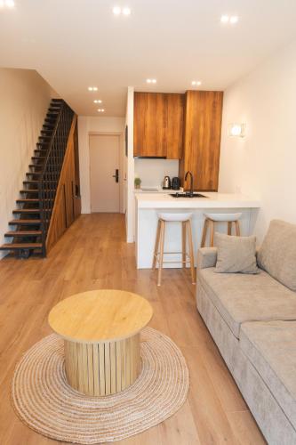 a living room with a couch and a table at Kala Collection-Timber in Gudauri