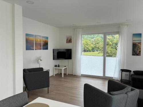 Televisyen dan/atau pusat hiburan di Ferienwohnung Eidem - Top Floor