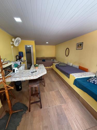 Postel nebo postele na pokoji v ubytování Suítes Toca da Coruja Blue