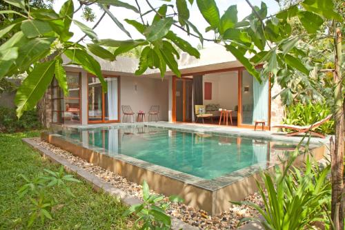 a swimming pool in the backyard of a villa at Templation Hotel in Siem Reap