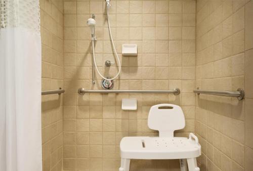 a bathroom with a toilet and a shower at Hampton Inn & Suites Middletown in Middletown