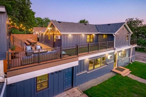 a house with a large deck with a patio at The Cove Guest House in Prescott