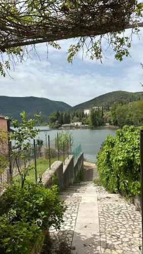 a path next to a body of water at Piediluco House - La Casa di Caio in Piediluco