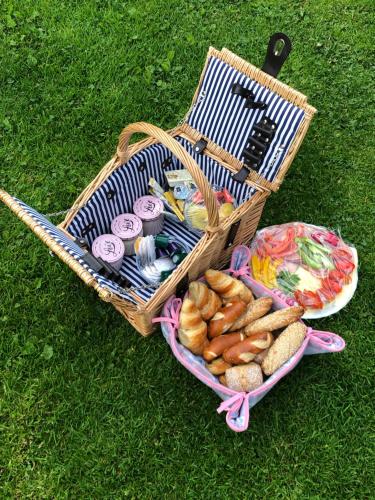 a basket filled with food and a plate of cookies at AH Carinthia Mallnitz - Carinthia Appartements in Mallnitz