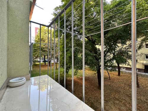 a glass facade of a building with a toilet at Mileticova street, keyless, AC in Nivy