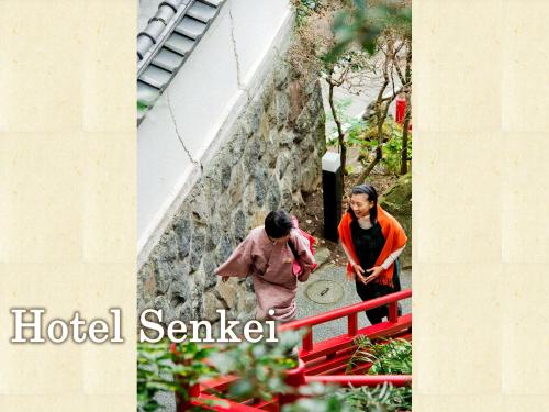 a couple walking down the stairs of a building at Senkei in Hakone