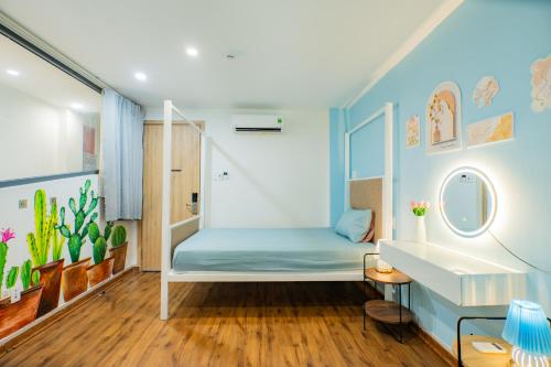 a bedroom with a bunk bed and a sink at Aluna Residence Homestay in Da Nang