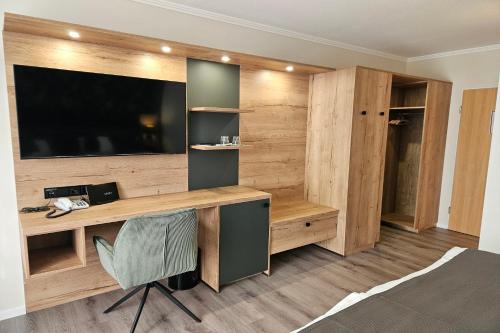 TV a/nebo společenská místnost v ubytování Waldhotel Kurfürst
