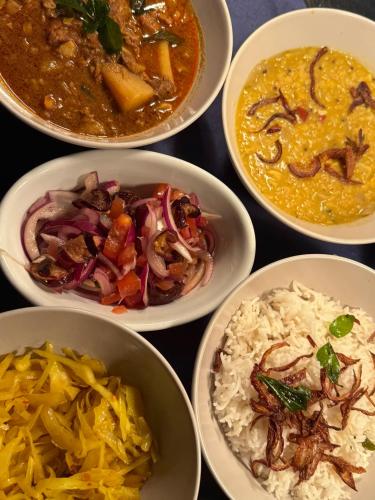a group of bowls filled with different types of food at Sids restaurant and bar with rooms in Cardiff