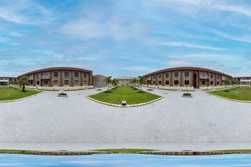 an image of a building with a courtyard at Hotel O Orlando Airport near Florida Mall in Orlando