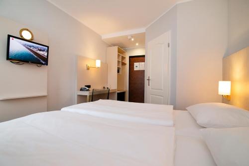 Postel nebo postele na pokoji v ubytování Nautic Hotel Bremerhaven