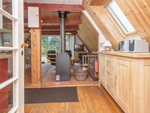 a kitchen and living room in a tiny house at 4 person holiday home in Rømø in Lakolk